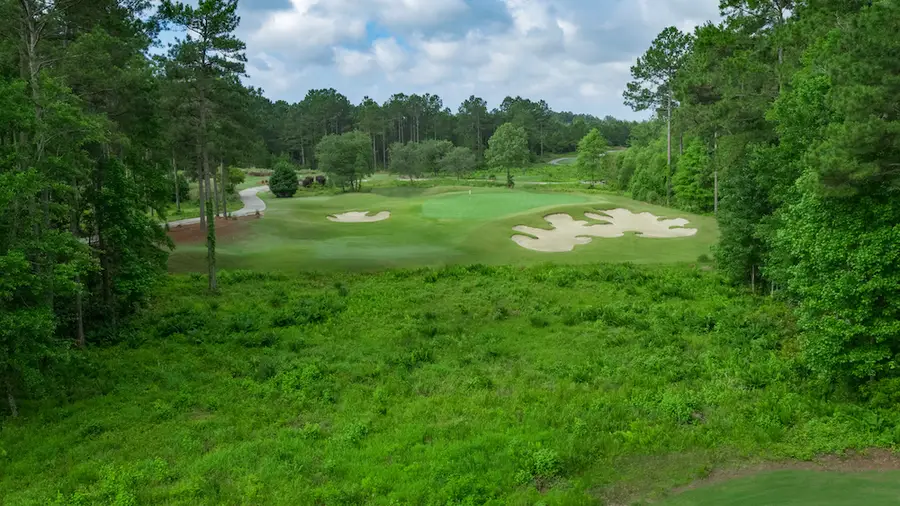 Leopards Chase Golf Club aerial of a green with sprawling bunkers among the trees
