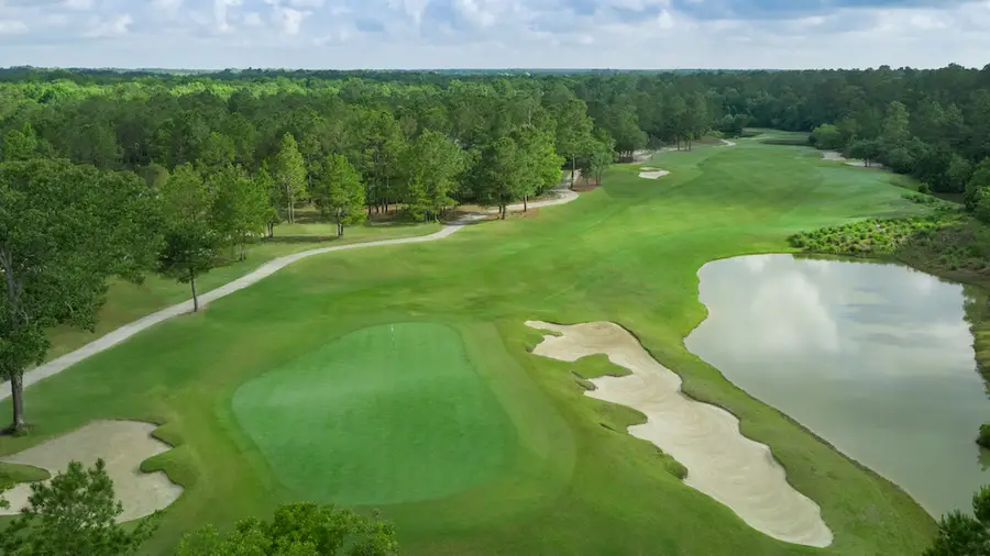 Leopards Chase Golf Club aerial of a green with bunkers beside a lake